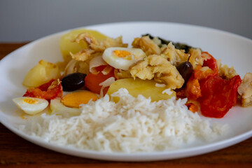 Traditional Portuguese bacalhoada with classic ingredients. When cod Oven