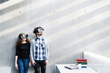 Young university students with VR headset. Virutal reality in academic settings.