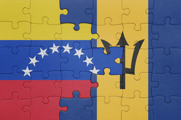 puzzle with the colourful national flag of venezuela and flag of barbados .