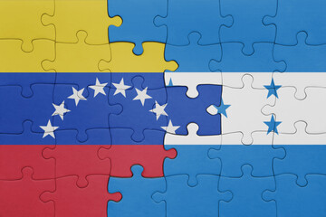 puzzle with the colourful national flag of venezuela and flag of honduras .