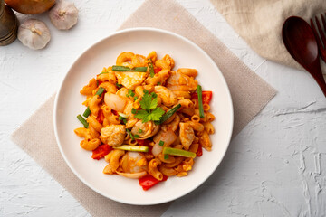 Stir Fried Macaroni with chicken breast tomatoes and egg in Tomato Sauce.fusion food.Top view