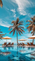 Luxury beach resort hotel swimming pool, leisure beach chairs and palm trees under blue sunny sky