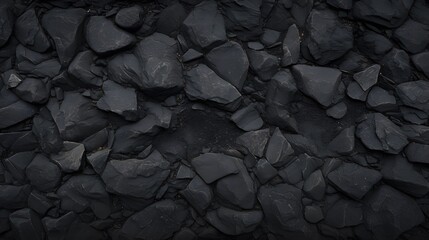 Dark asphalt texture with tiny pebbles and cracks