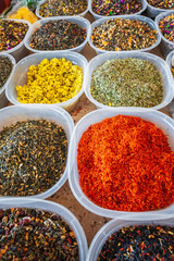 assortment of oriental herbal and flower teas on the counter at the Asian spice market