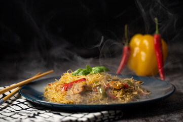 Smoky Asian salad with glass noodles, chicken, prawn, shrimp and vegetables