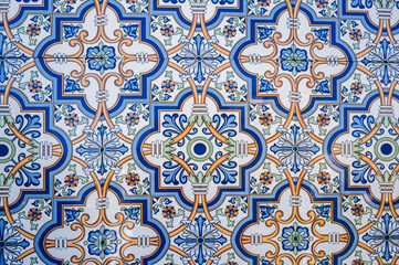 ceramic tile with a traditional Uzbek ornament with a oriental pattern. The wall of the white mosque Minor in Uzbekistan