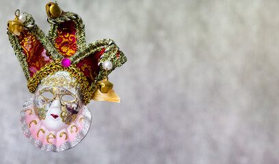 Venetian carnival mask isolated on gray background.
