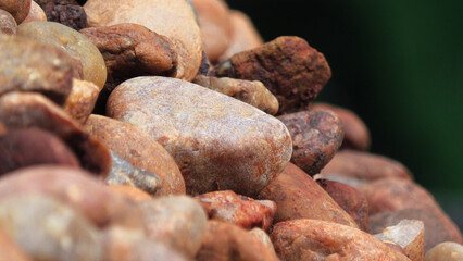 Closeup of piled brown cobblestones