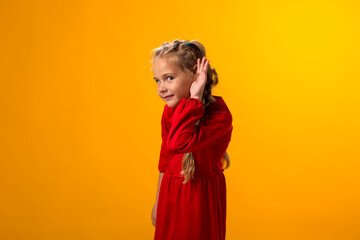 Kid girl eavesdropping, overhearing confidential secret conversation, keeping hand at his ear....