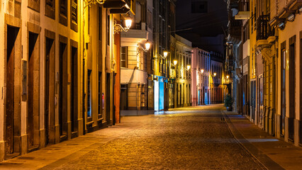 Picturesque cobbled streets with old buildings at night in La Palma, Canary Islands.