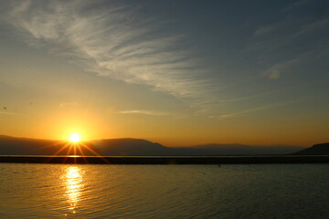 The sunrise on the shores of the Dead Sea