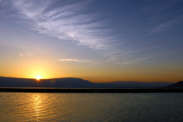 Fototapeta premium The sunrise on the shores of the Dead Sea