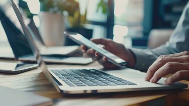 A person working on multiple devices, surrounded by digital technology