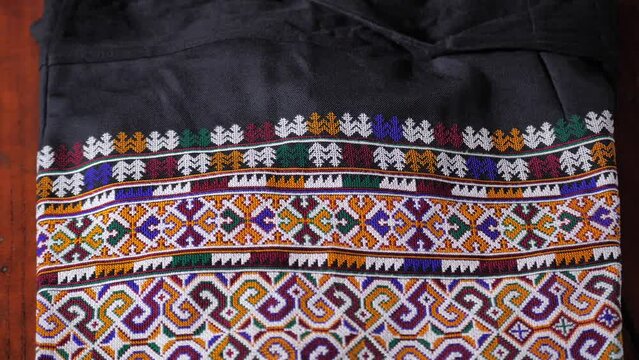 The culture and traditions of the lu mien ethnic group are reflected in their traditional clothing, which features unique decorations and creative textile patterns specific to their tribe.Thailand2023