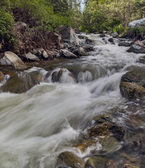 running small fast river between rocks