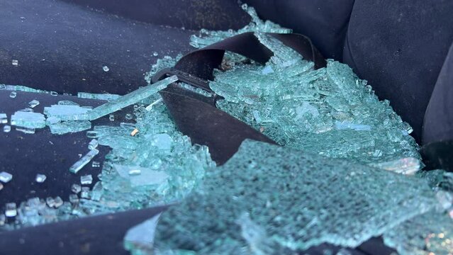 Glass from car window laying on seat in accident scene 4k