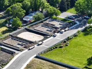 the intersection is being built between two roads and an open parking lot © Wirestock