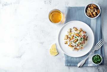 Mussels with  rice and vegetables in a plate