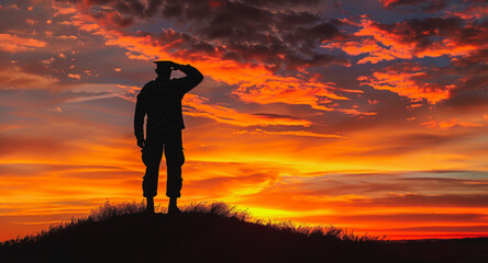 Soldier saluting at sunset with dramatic sky