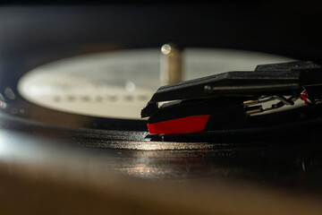 gramophone needle close-up, vinyl record with clear sound tracks and stylus, music concept 