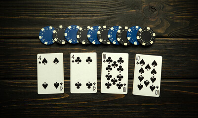 A successful and winning layout of a poker game on a vintage table in a club from a combination of...