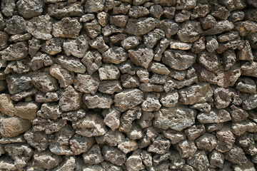 A wall constructed from lava rocks on the volcanic island of Lanzarote in the Canary Islands of Spain off the coast of Northern Africa