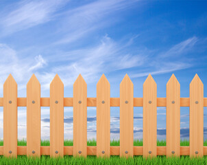 Wooden fence with grass with blue sky in the background. 3d-rendering