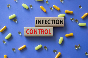 Infection Control symbol. Concept word. Infection Control on wooden blocks. Beautiful purple...