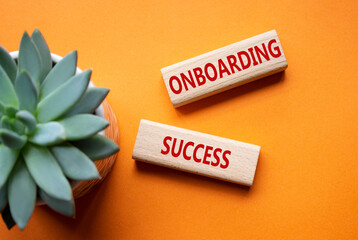 Onboarding Success symbol. Concept word Onboarding Success on wooden blocks. Beautiful orange...