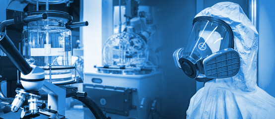 Laboratory equipment. Chemical protection suit for scientist. Equipment for experiments with toxic...