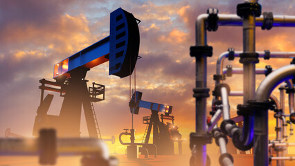 Crude oil production site. Pumps pumping petroleum at sunset. Oil production. Petroleum derricks on...