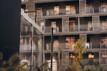 Modern urban view, building facade of multi storey residential building with balcony