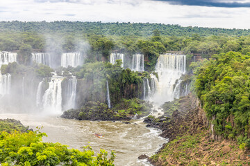 Iguazu falls waterfall in Argentina and Brazil border on the river Iguazu. Tropical landscape with...