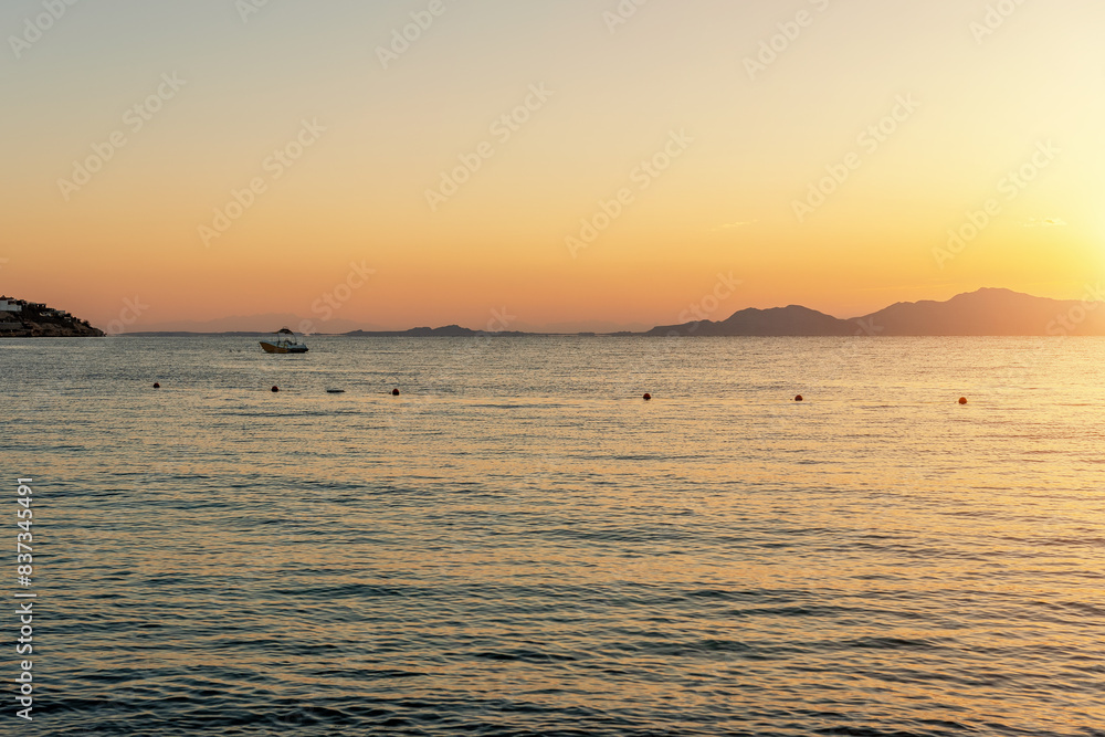 Wall mural View of calm beautiful sea during sunset. Holiday vacation and travel concept.