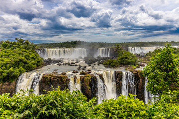 Iguazu falls waterfall in Argentina and Brazil border on the river Iguazu. Tropical landscape with...