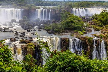 Iguazu falls waterfall in Argentina and Brazil border on the river Iguazu. Tropical landscape with...