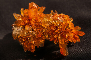 natural creedite crystal formation with orange color in sunlight