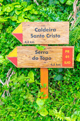 Wooden direction signs for Fajã de Santo Cristo and PR1 for Serra do Topo. São Jorge Island-Azores-Portugal.