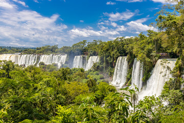 Iguazu falls waterfall in Argentina and Brazil border on the river Iguazu. Tropical landscape with powerful waterfall stream in the jungle. Iguassu falls, cataratas iguazu natural wonder national park