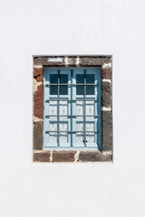 Fototapeta premium Window in white house on Santorini Island. Greece.