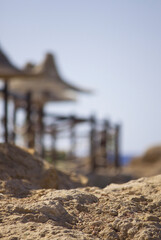Fototapeta premium View on sunshades on beach in resort, Sharm El Sheikh, Red Sea coast, Egypt