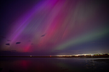 Northern lights / aurora over Dublin Bay in Ireland after G5 solar storm