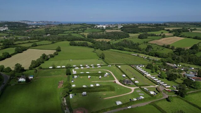 Stoke Gabriel, South Devon, England: DRONE VIEWS: The drone circles a caravan park showing the surrounding countryside. South Devon is a popular UK holiday destination owing to its natural beauty (1).