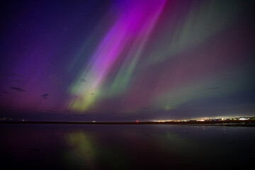 Northern lights / aurora over Dublin Bay in Ireland after G5 solar storm
