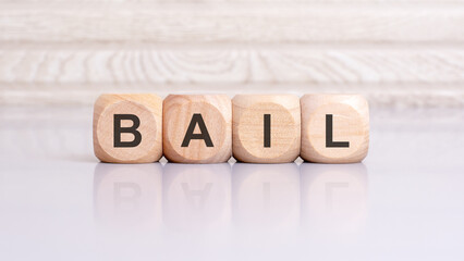 the word bail is written on a wooden blocks structure. Blocks on a bright gray background....