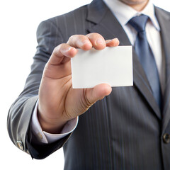 A man is holding a white business card in his hand