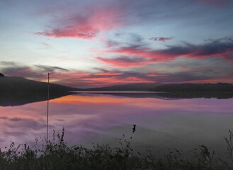 Sunset over a lake in Quebec country, Canada