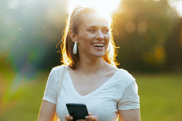 smiling modern 40 years old woman in white shirt