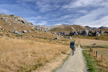Woman outdoors on her way to go rock climbing and bouldering