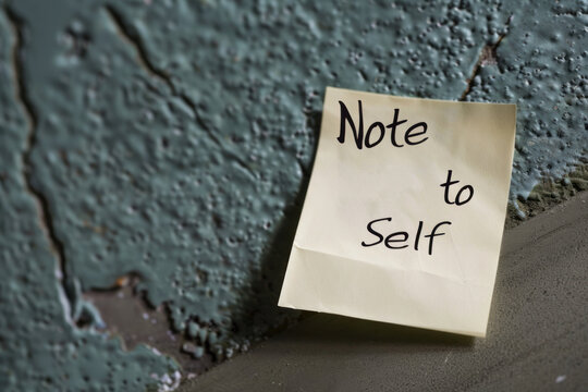  'Note to Self' Post-It on a Weathered Wall